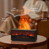 A black fireplace ultrasonic aroma diffuser is shown on a wooden table, emitting realistic fire and fragrance diffusion.
