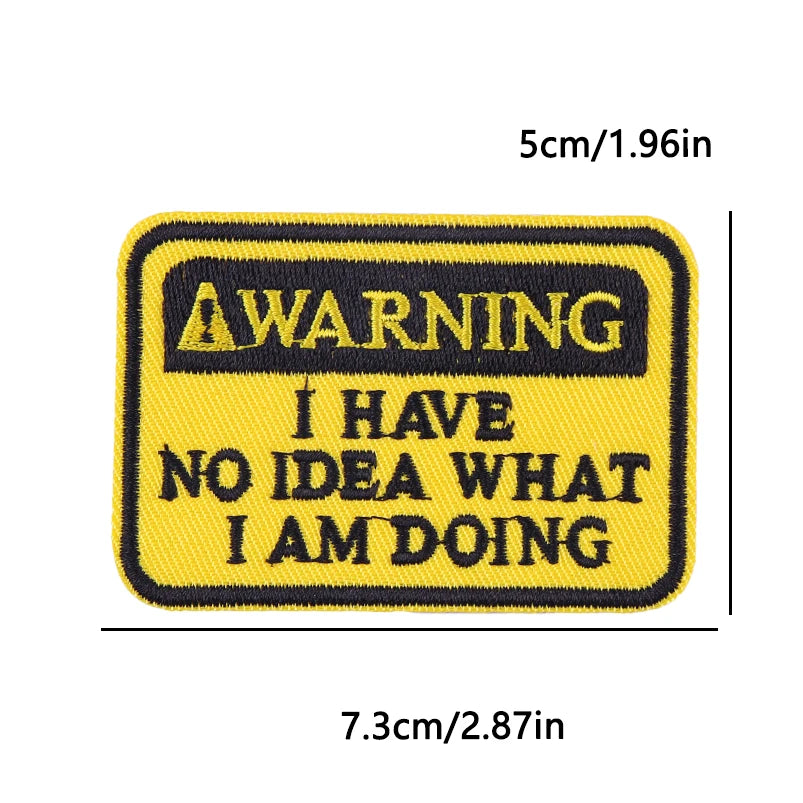 Yellow embroidered iron-on patch with black text warning I have no idea what I am doing
