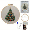 Embroidery DIY Art Kit featuring a handcrafted Christmas tree design on a canvas with tools and thread.