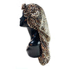 A black mannequin head wearing a leopard print satin hair bonnet.