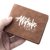 A brown PU leather wallet with white stylized text and dice design is held in a hand.
