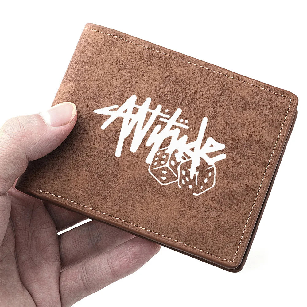 A brown PU leather wallet with white stylized text and dice design is held in a hand.
