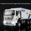 A white diecast model truck triggers sound and light effects, featuring a cab and cargo box.