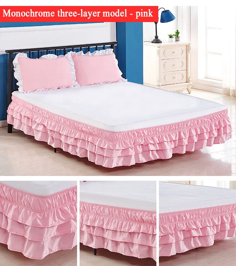 Monochrome three-layer pink bed skirt wrapping around a bed, shown in a bedroom setting.