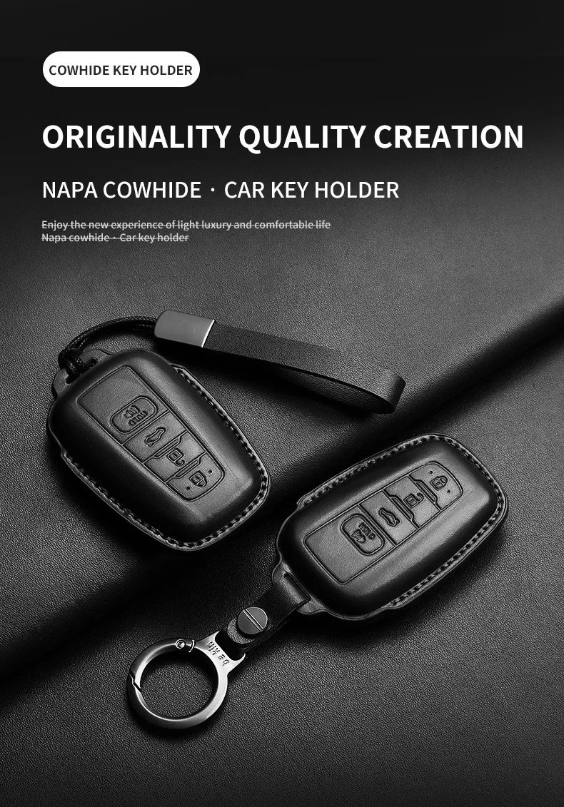 A black genuine leather car key holder featuring a key and a separate key cover is displayed on a dark surface.