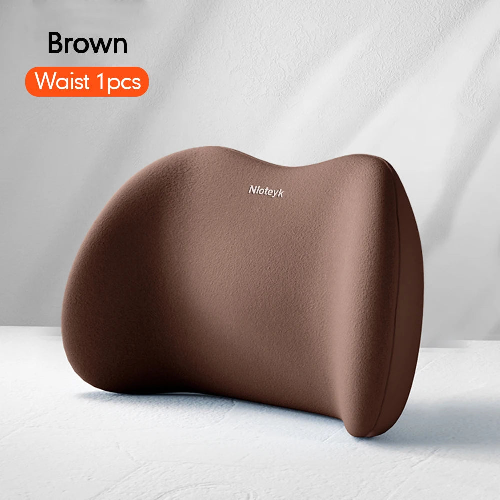 Brown memory foam car headrest and lumbar support pillow shown on a white surface.