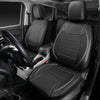 A full set of black universal leather car seat covers installed in a vehicle interior.