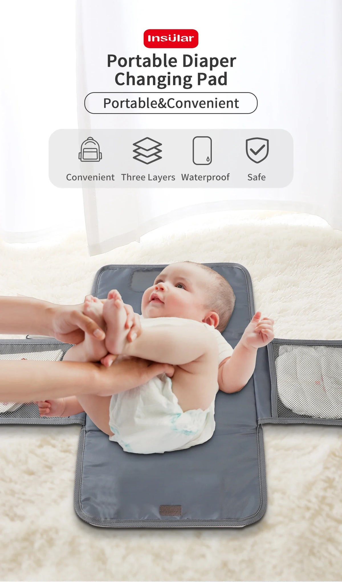 A baby is being changed on a gray portable diaper changing pad with a waterproof cover and storage bag.