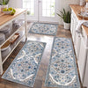 A long rectangular blue and white patterned kitchen rug placed on a wooden floor.