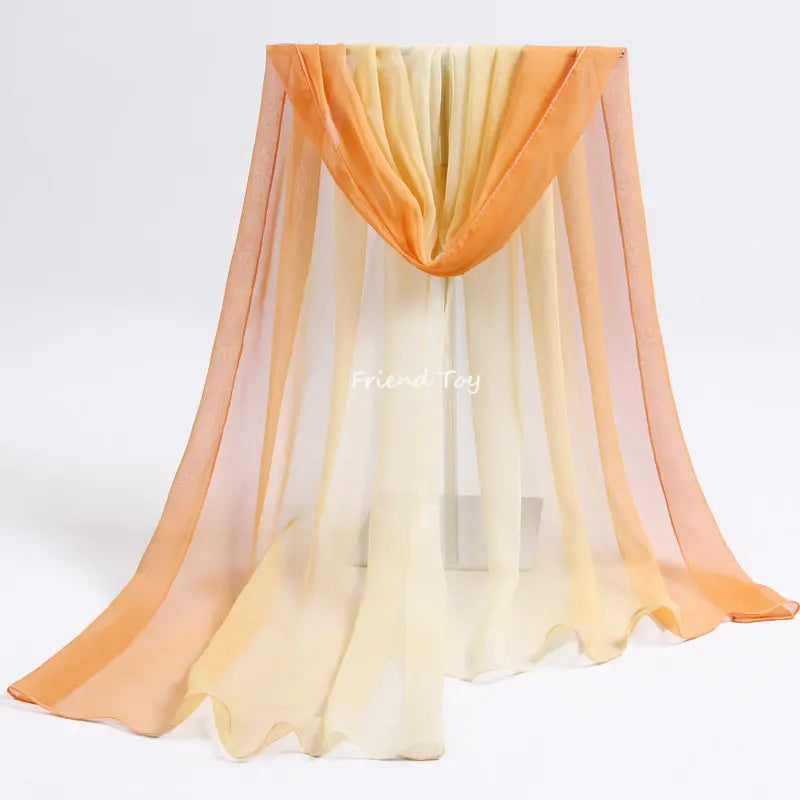 Montessori playsilks in shades of peach and cream draped like a curtain for imaginative play