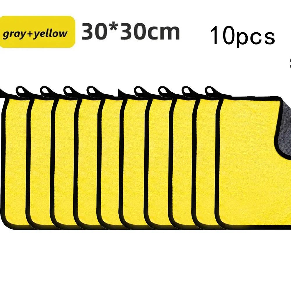 A set of ten yellow and gray microfiber car cleaning towels shown in a row.
