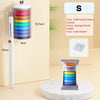 A long white toilet brush with a holder and a set of disposable brush heads, including a bucket and wall sticker.