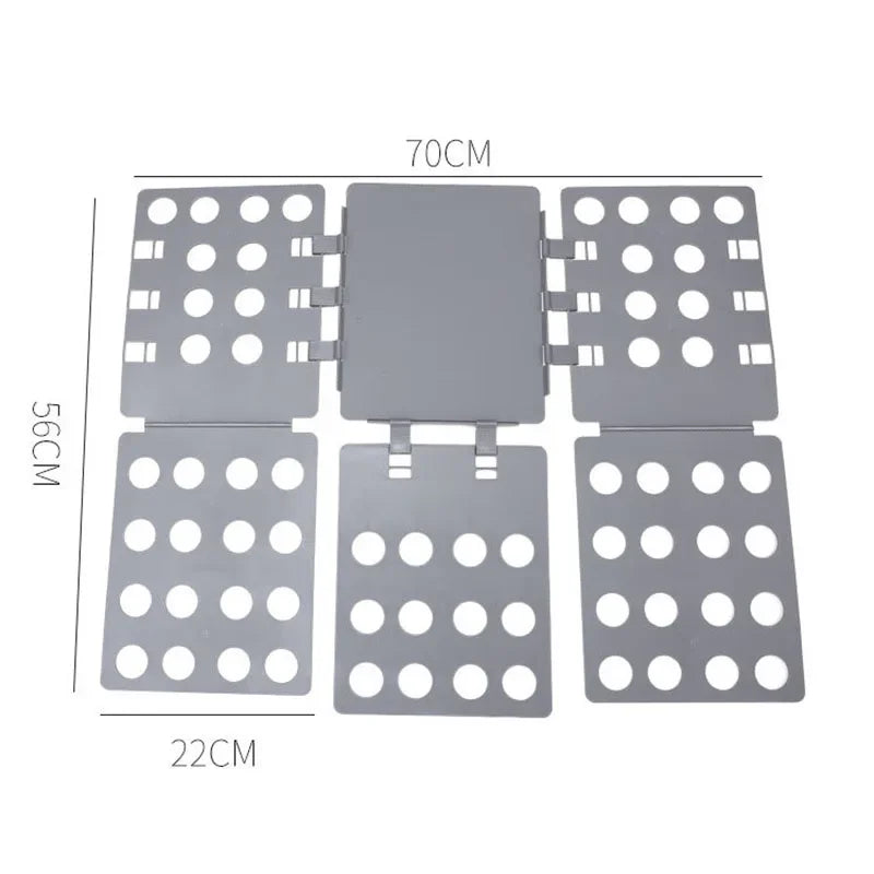 A gray magic clothes folding board with a central panel and surrounding circular holes for organizing t-shirts.