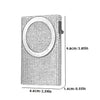 A slim aluminum pop-up card wallet with a textured surface and a circular opening.