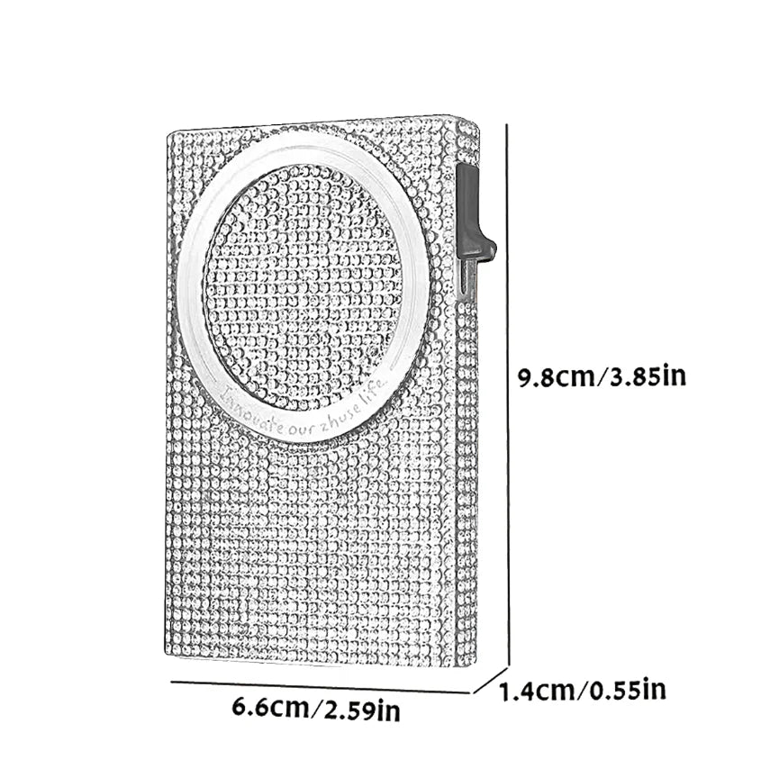 A slim aluminum pop-up card wallet with a textured surface and a circular opening.