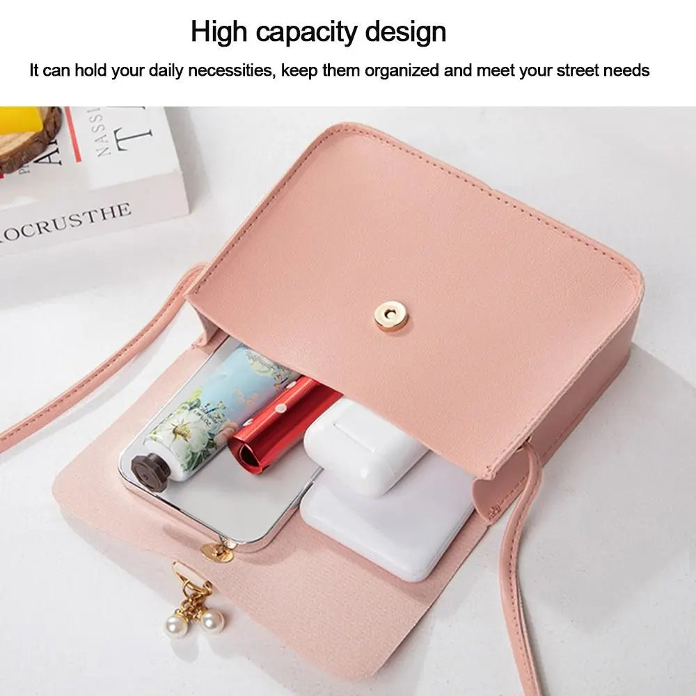 A pink compact crossbody handbag is shown open, displaying various small items like a card and white accessories.