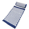 A dark blue acupressure mat and pillow set with white dots for pain relief and relaxation.