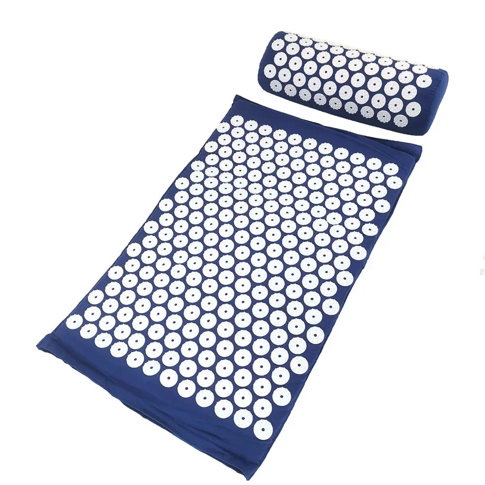 A dark blue acupressure mat and pillow set with white dots for pain relief and relaxation.
