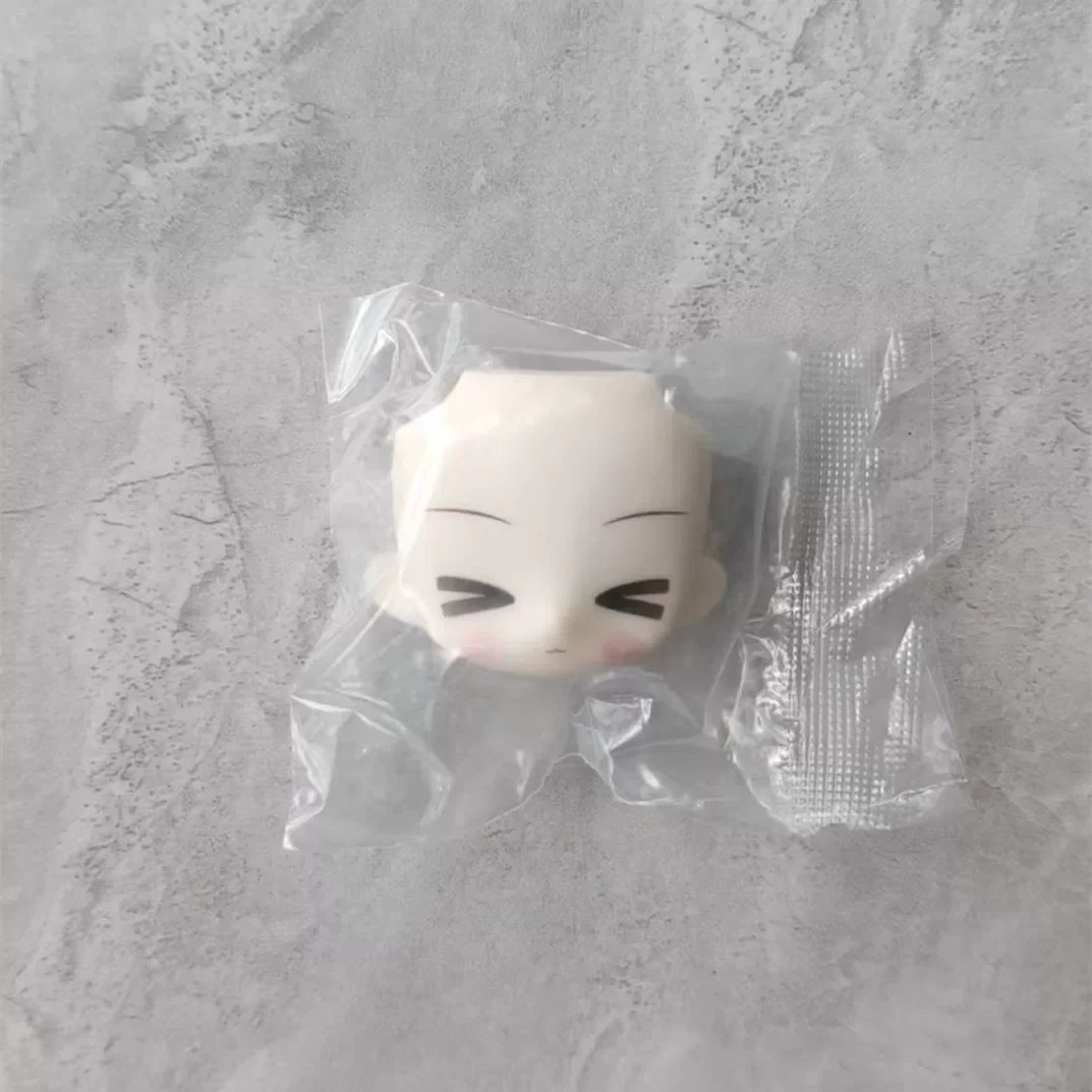 A white articulated BJD collectible figurine in a clear plastic blind box packaging.
