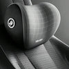 A close-up of a black memory foam car headrest and neck support pillow featuring a double concave arc design.