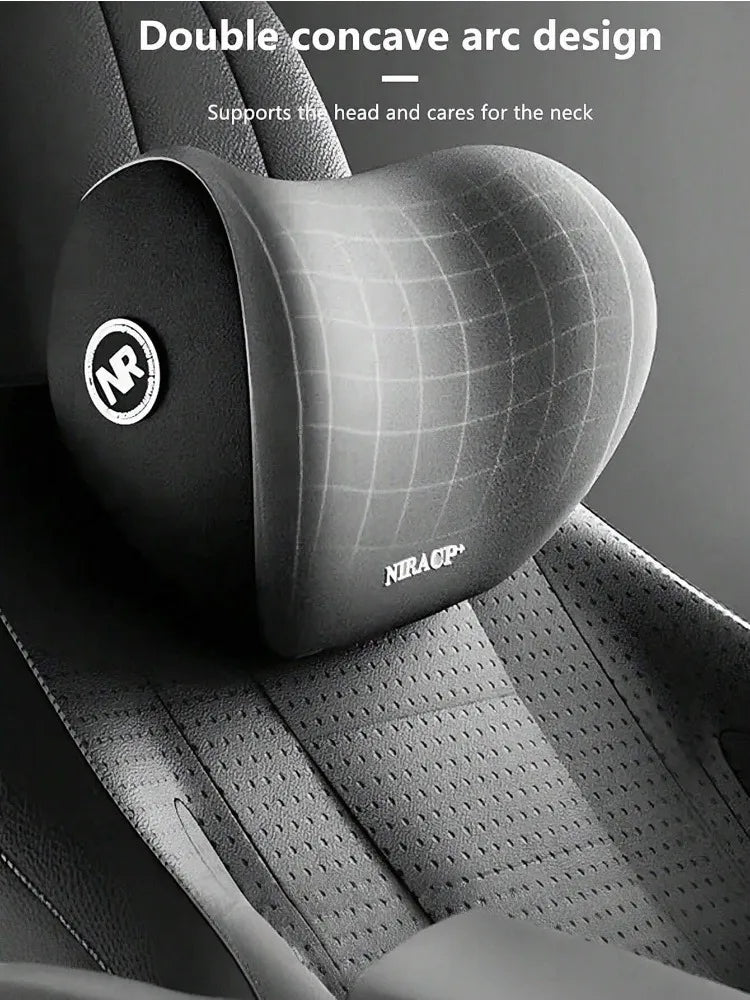 A close-up of a black memory foam car headrest and neck support pillow featuring a double concave arc design.