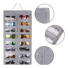 A gray felt organizer with sixteen slots for storing and hanging various pairs of eyeglasses.