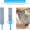 A hand is using a gray microfiber cloth to clean a sink, demonstrating the removable and washable feature of the duster.