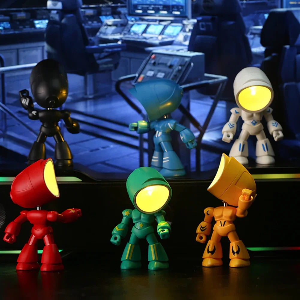 A collection of bendable robot night lights in various colors including black, blue, white, and red, displayed on a dark surf