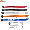 Set of various metal and plastic components for a KTM side stand kit including rods springs and fasteners