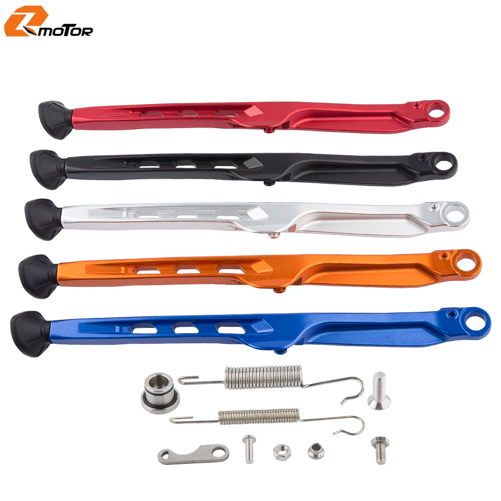 Set of various metal and plastic components for a KTM side stand kit including rods springs and fasteners