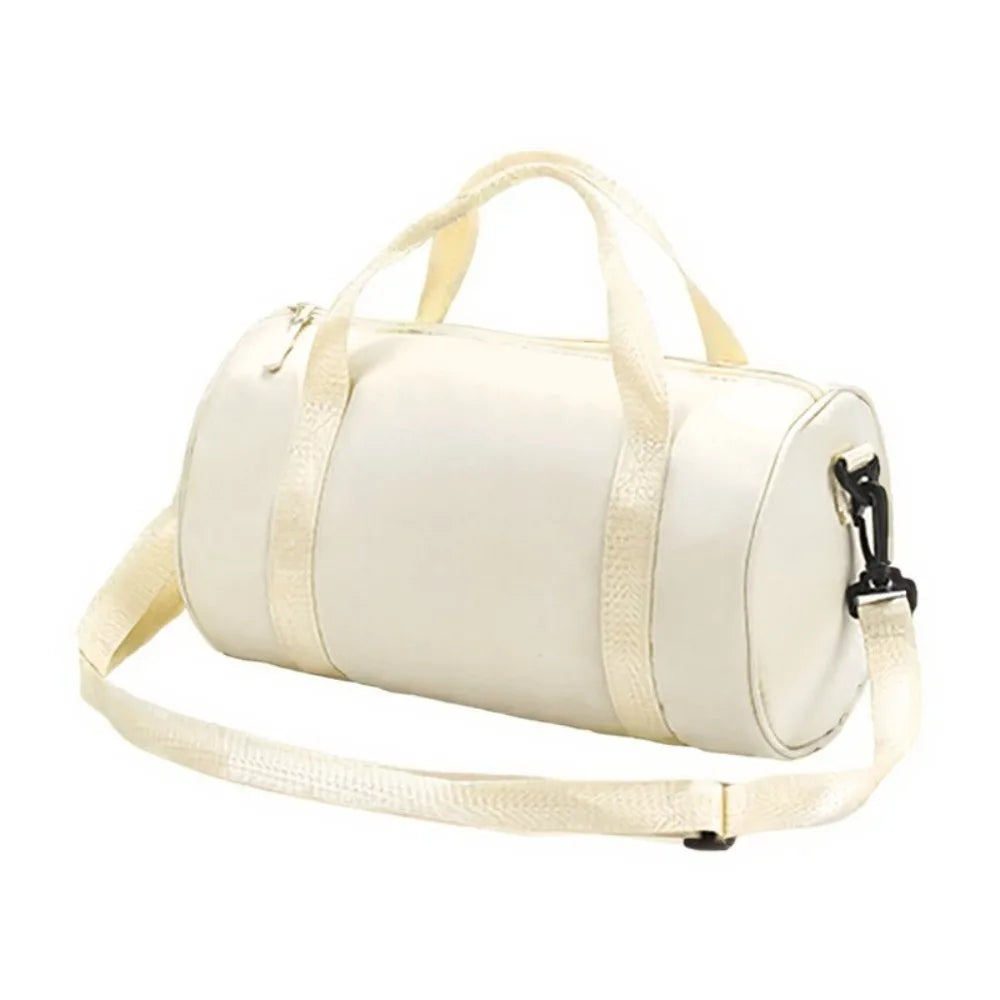 A cream-colored compact nylon gym bag with a light beige adjustable strap.