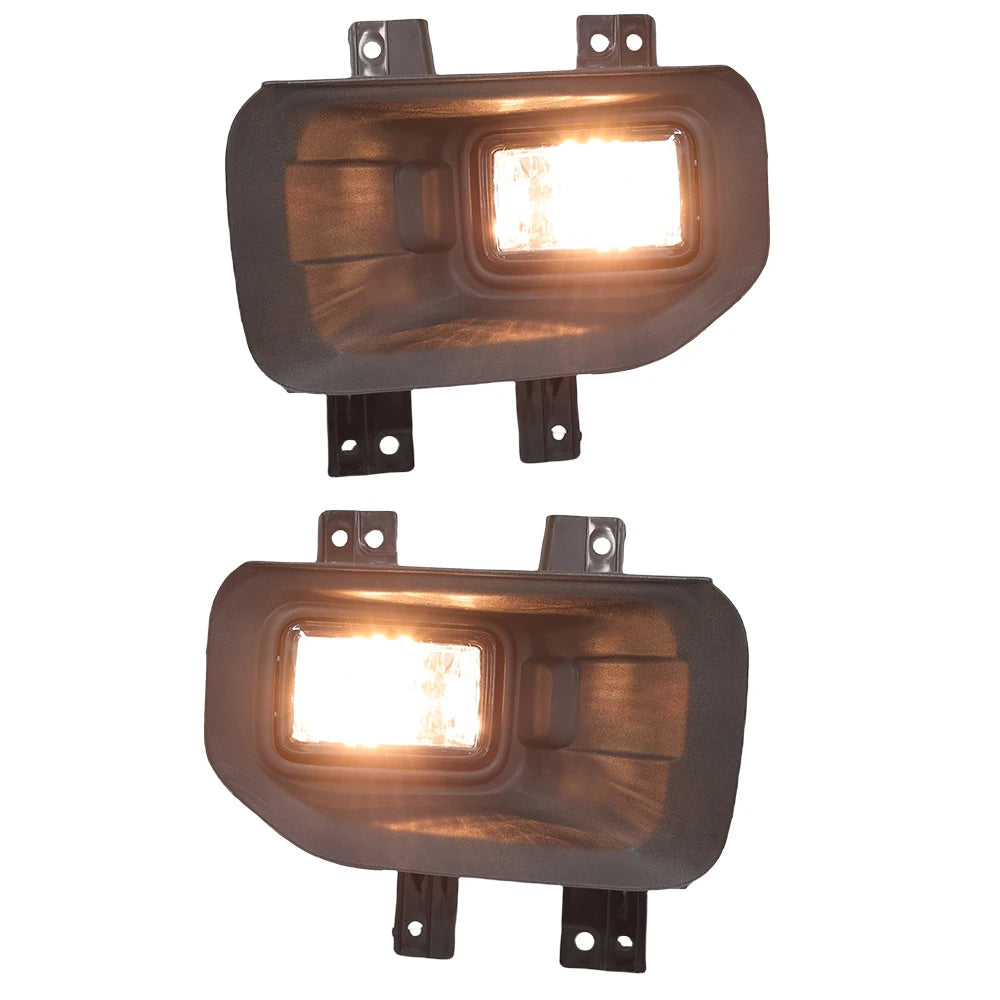 A rectangular automotive fog light assembly with a clear lens and halogen bulb, mounted on a bracket.