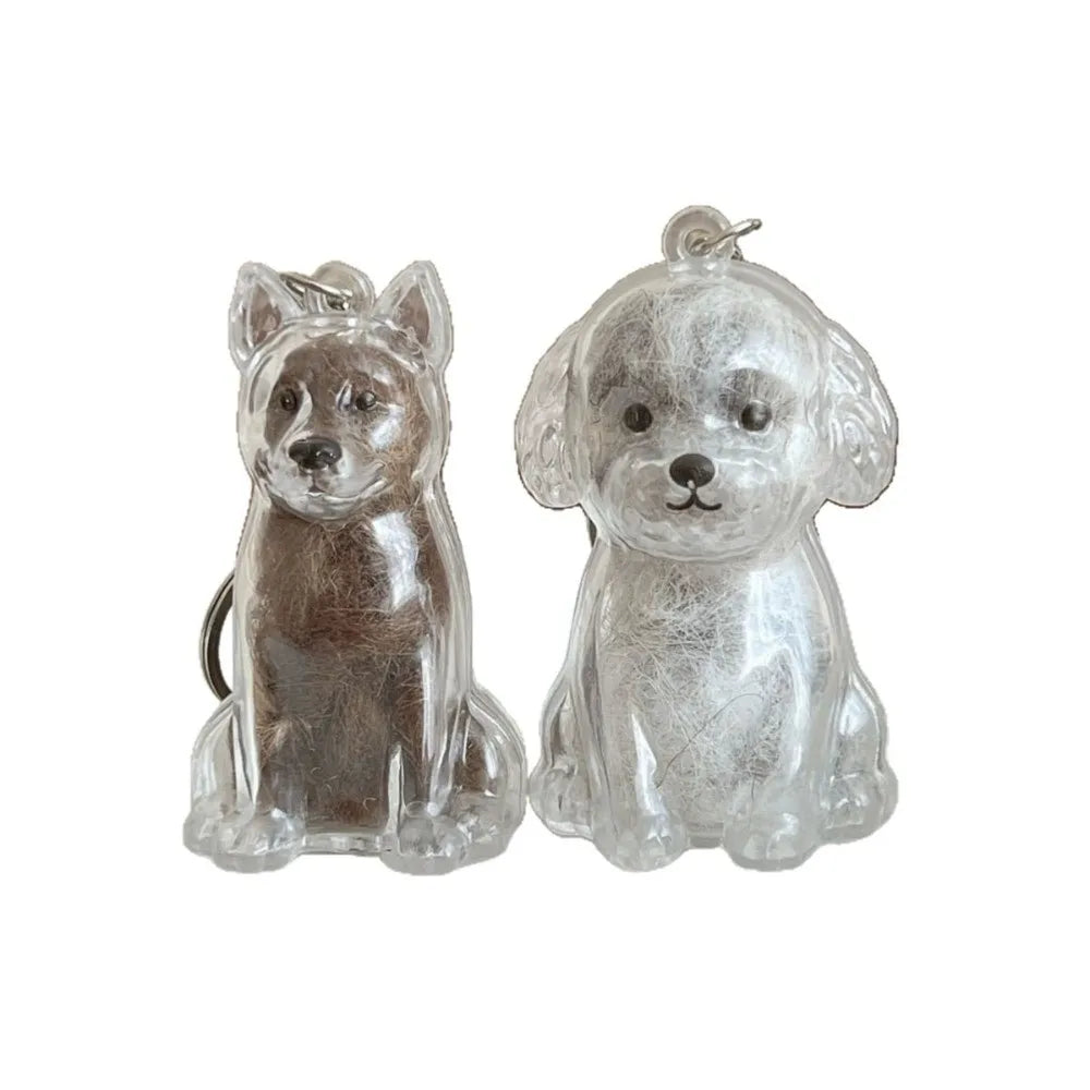 A pair of clear, textured silicone dog figurines shaped like a terrier and a poodle, used as a keepsake fur storage pendant k