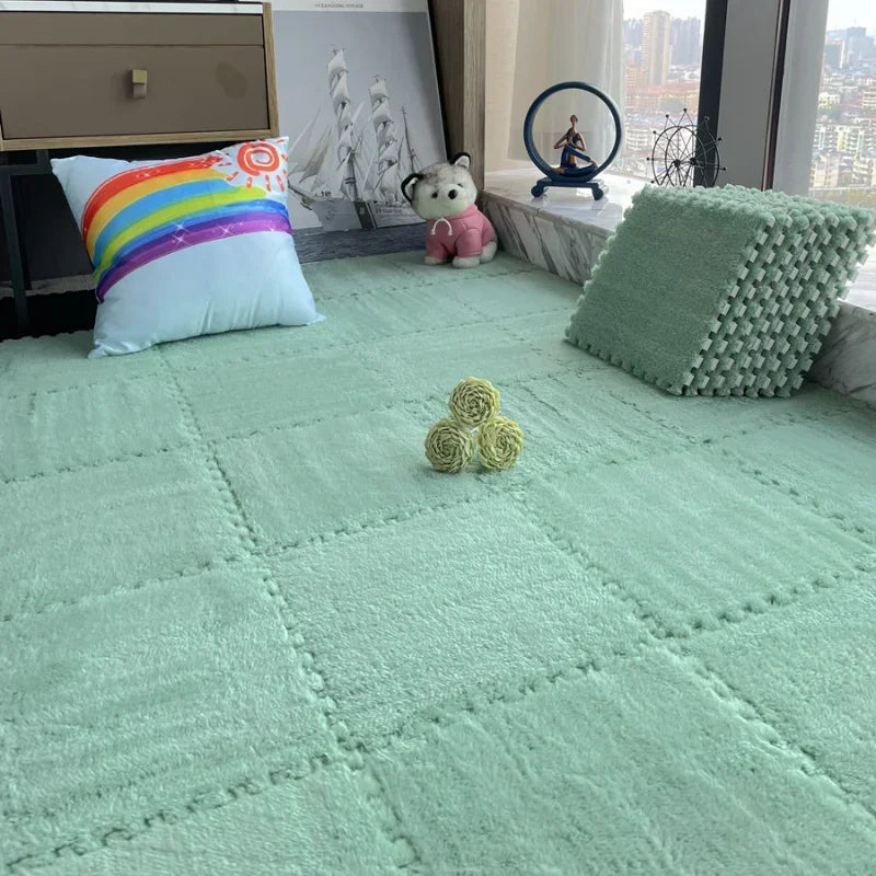 A bright teal floor with interlocking soft plush tiles, a stuffed animal, and decorative items.