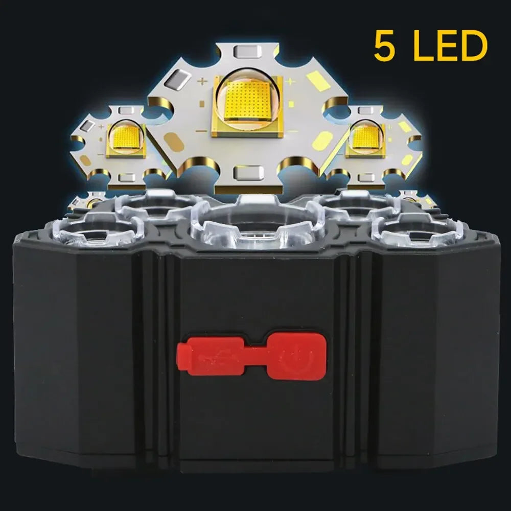 A black rechargeable headlamp with five yellow LED lights mounted on the front and a red switch.