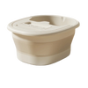 A beige foldable foot bath tub with a lid is shown from above.