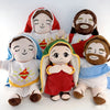 A set of three plush figures depicting Jesus in various poses and clothing.
