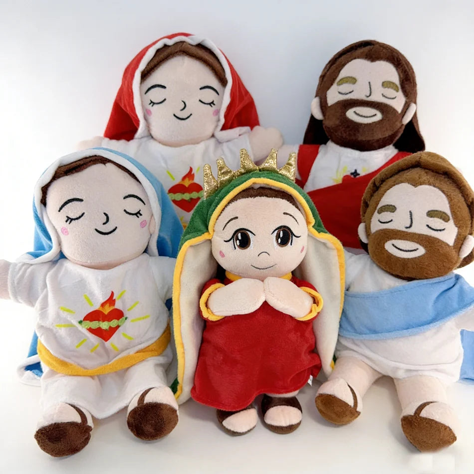 A set of three plush figures depicting Jesus in various poses and clothing.
