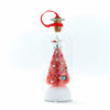 A clear glass message bottle shaped like a Christmas tree with glitter and a snowy scene, topped with a red cork and wire.