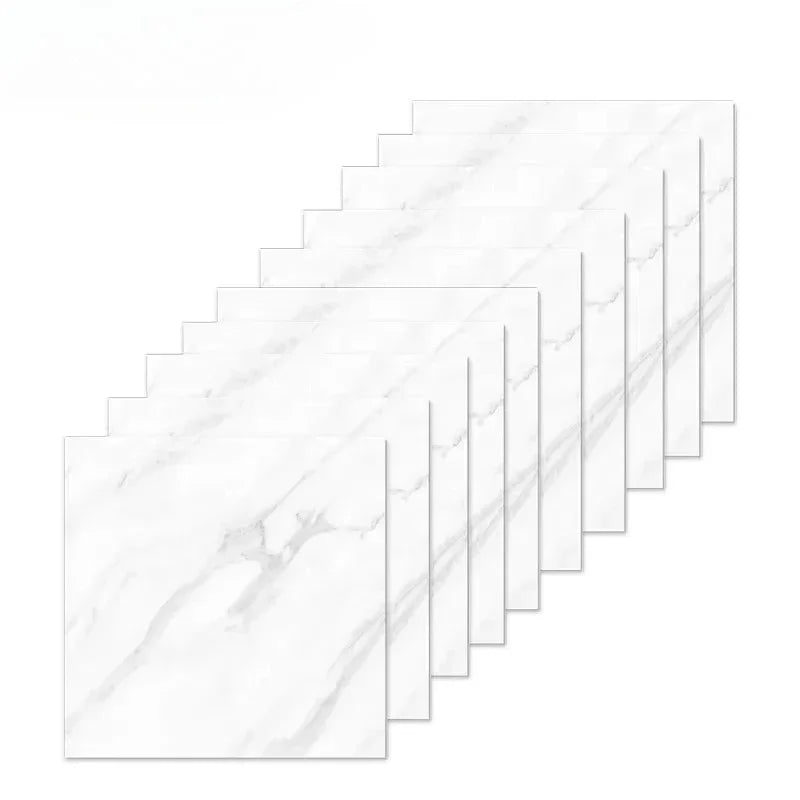 A set of rectangular white marble peel-and-stick tiles arranged in a diagonal pattern.