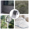 A roll of window screen repair tape used to patch holes in mesh screens and a white sheet with blue accents.