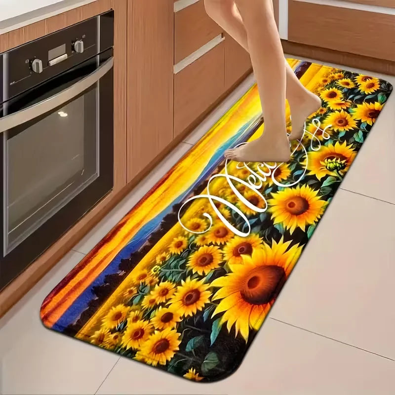 A long, narrow sunflower patterned non-slip mat placed on a kitchen floor next to an oven.