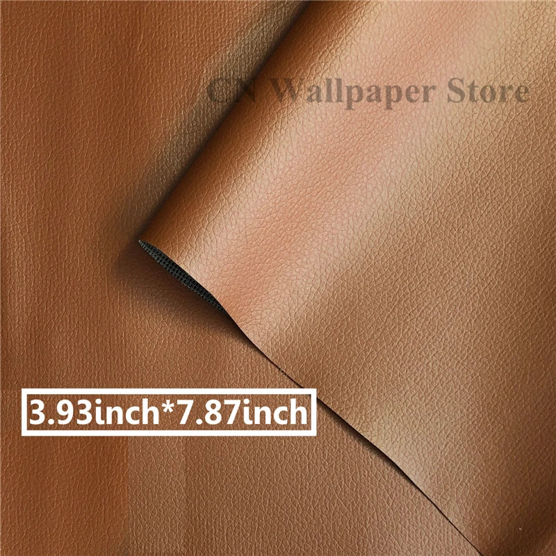 Close-up of a brown leather material showing a stitched edge and a size measurement label.