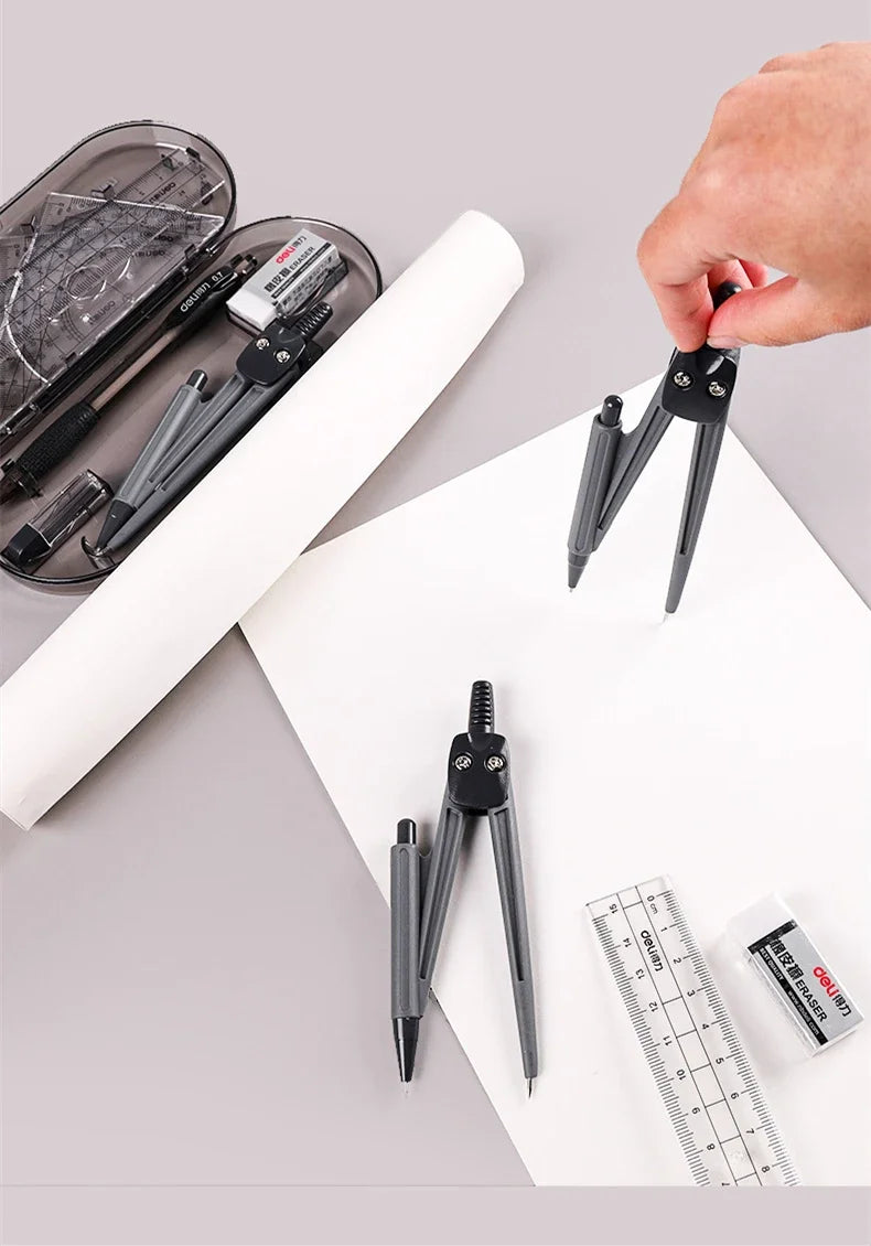 A hand holds a black geometry drafting set including a compass and ruler on a white sheet of paper.