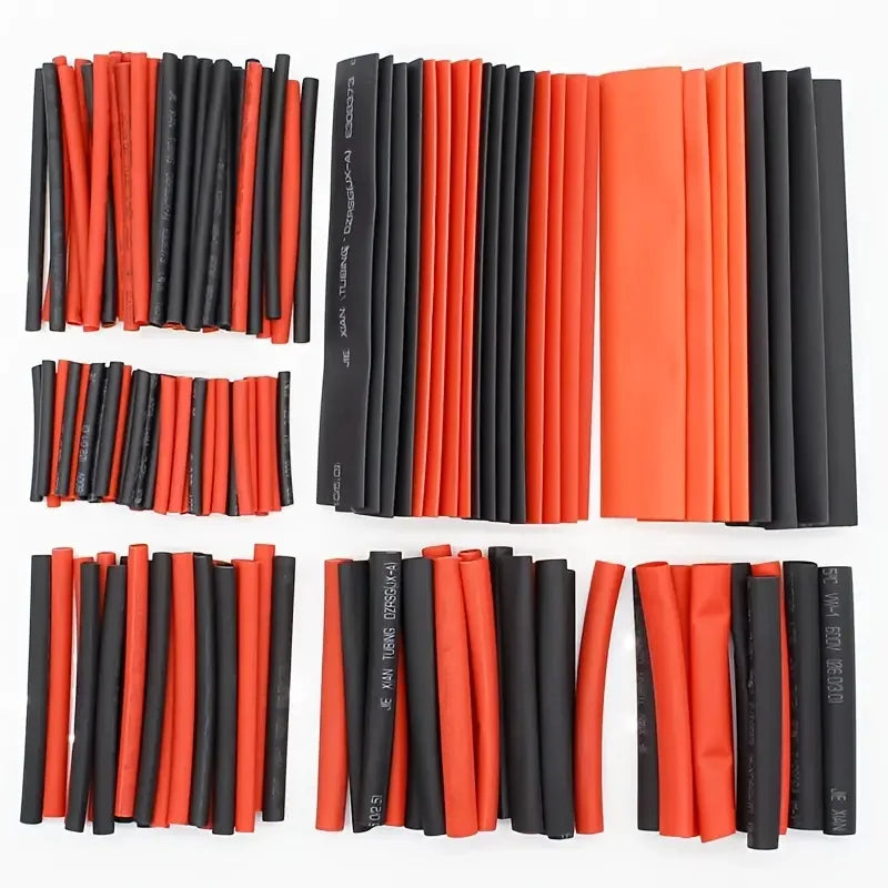 Assortment kit of 127 pieces of heat shrink tubing in red and black colors.