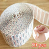 Roll of 50 waterproof breathable adhesive bandages for wound care with a loose strip shown next to a hand