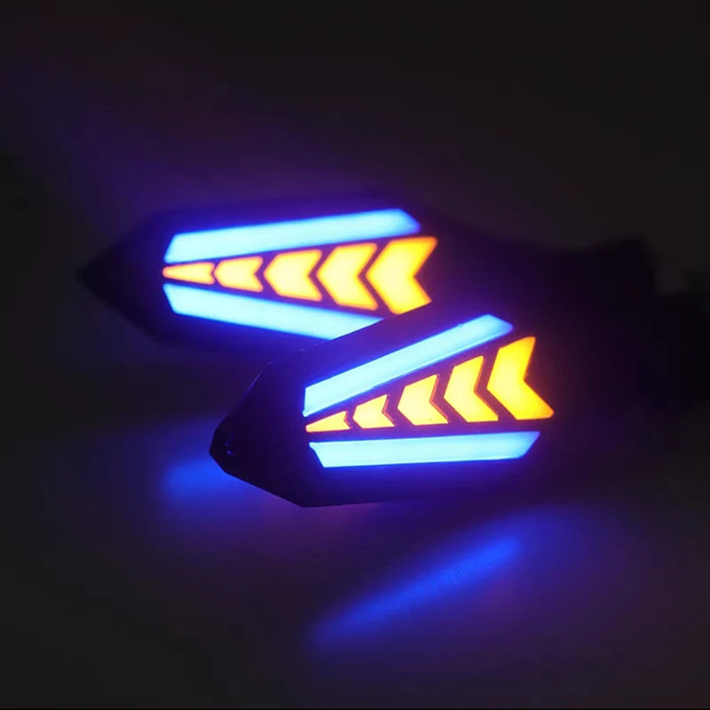 A close-up of a blue LED flowing turn signal indicator light on a motorcycle part.