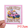 Pink vintage car embroidered patch featuring pumpkins and farm fresh text