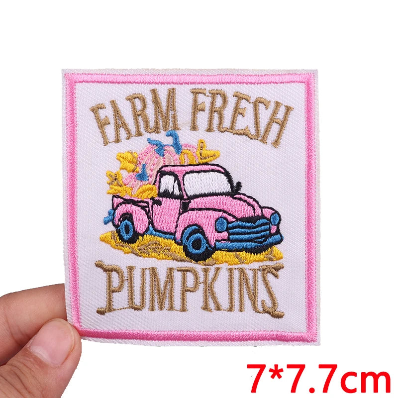 Pink vintage car embroidered patch featuring pumpkins and farm fresh text