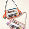 A clear PVC shoulder bag with an adjustable strap featuring a smartphone and sunglasses.